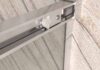 Mampara
  de ducha NEXO frontal 1 fijo - 1 puerta corredera perfil MINIMALISTA Cromo
  brillo